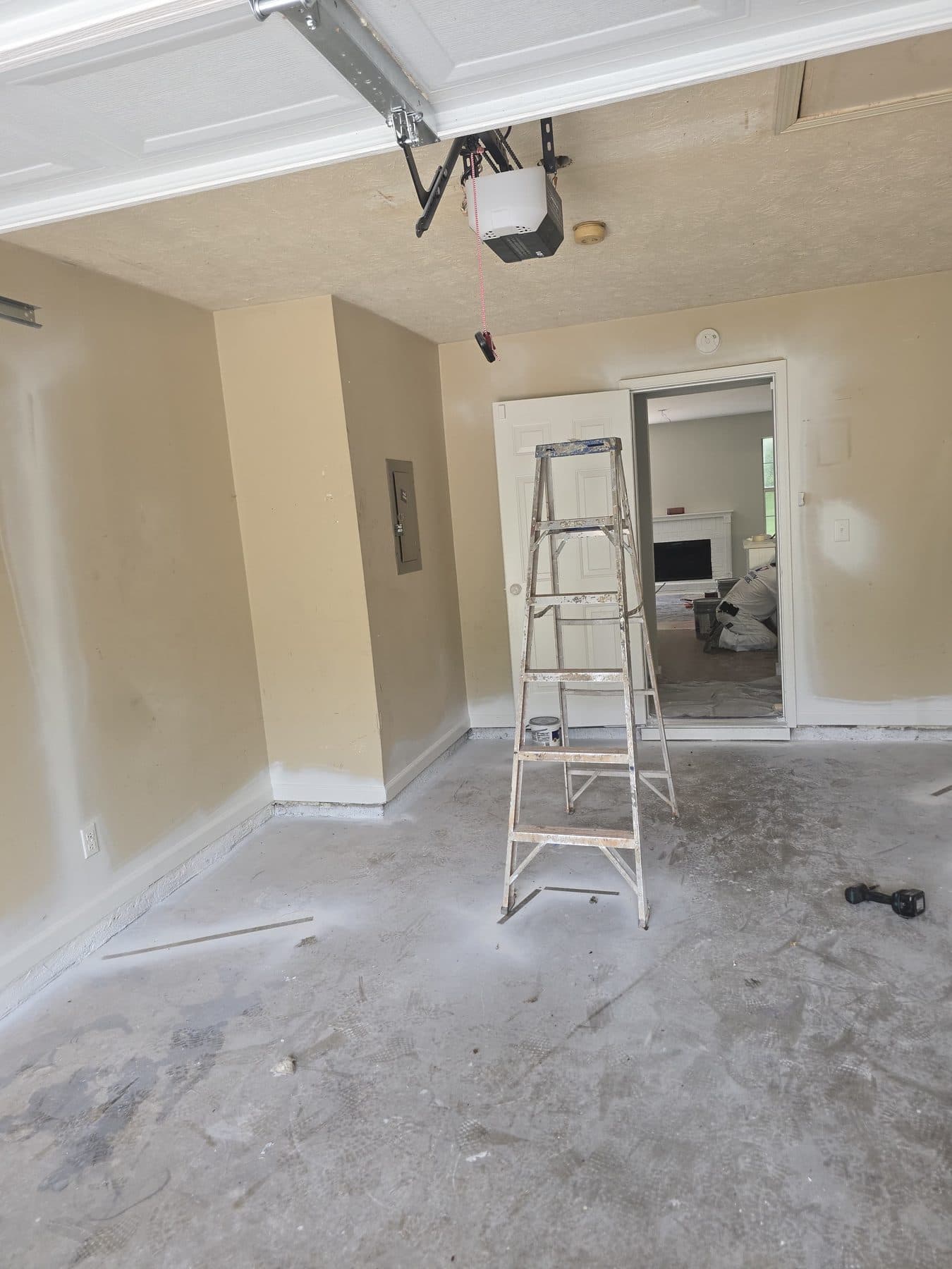 Ladder set up mid-renovation in a garage conversion