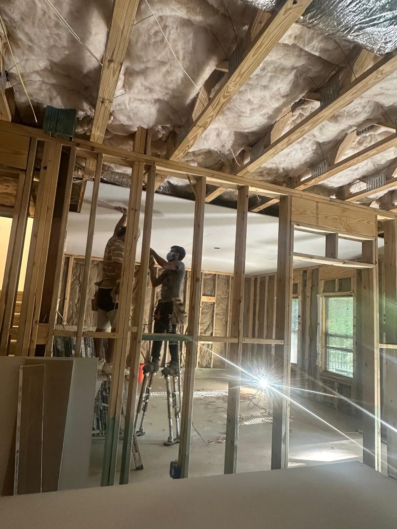 Framing crew building out a new room addition