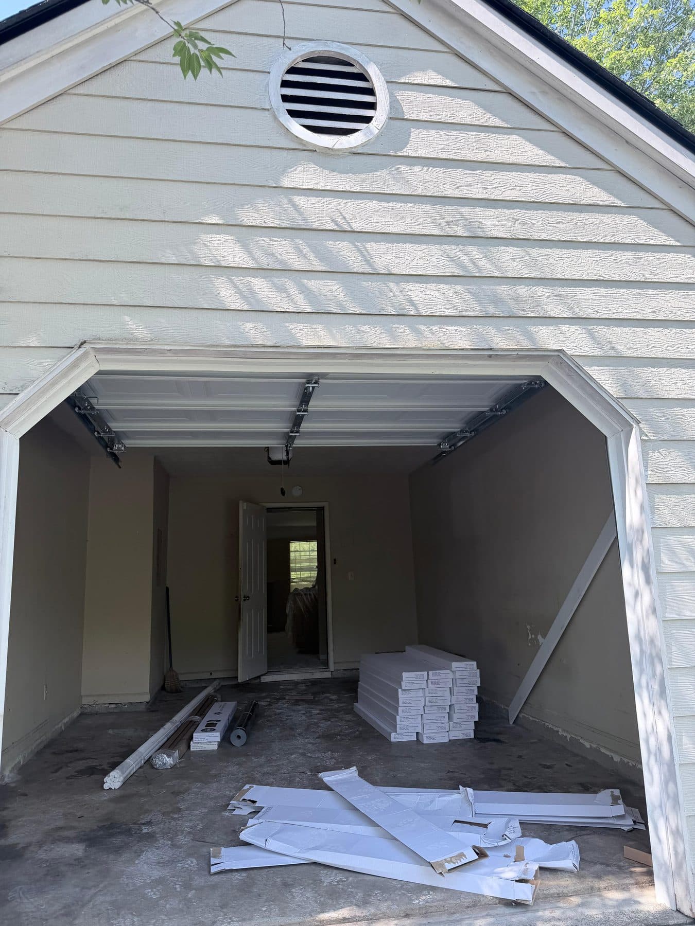 Garage mid-renovation with materials staged