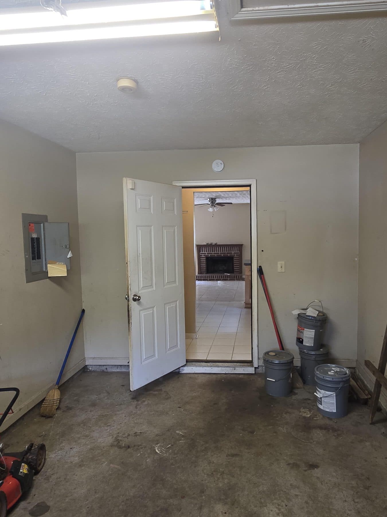 Hallway mid-renovation with tools staged on the floor