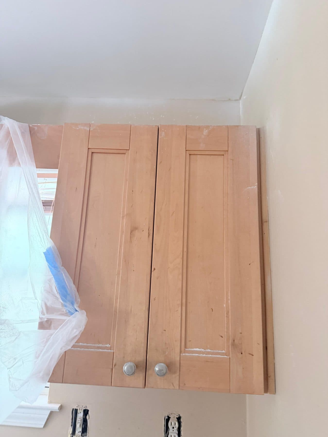 Kitchen cabinets being installed