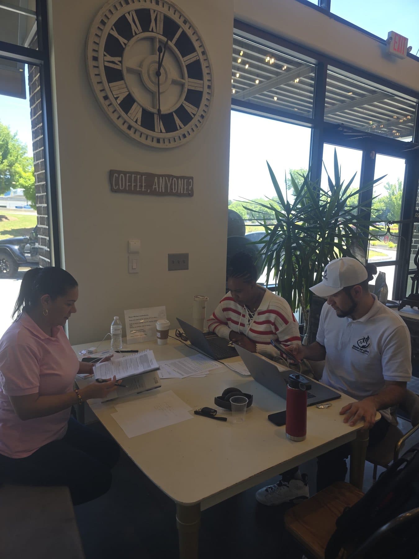 The Hand of Life Renovations team planning a client project